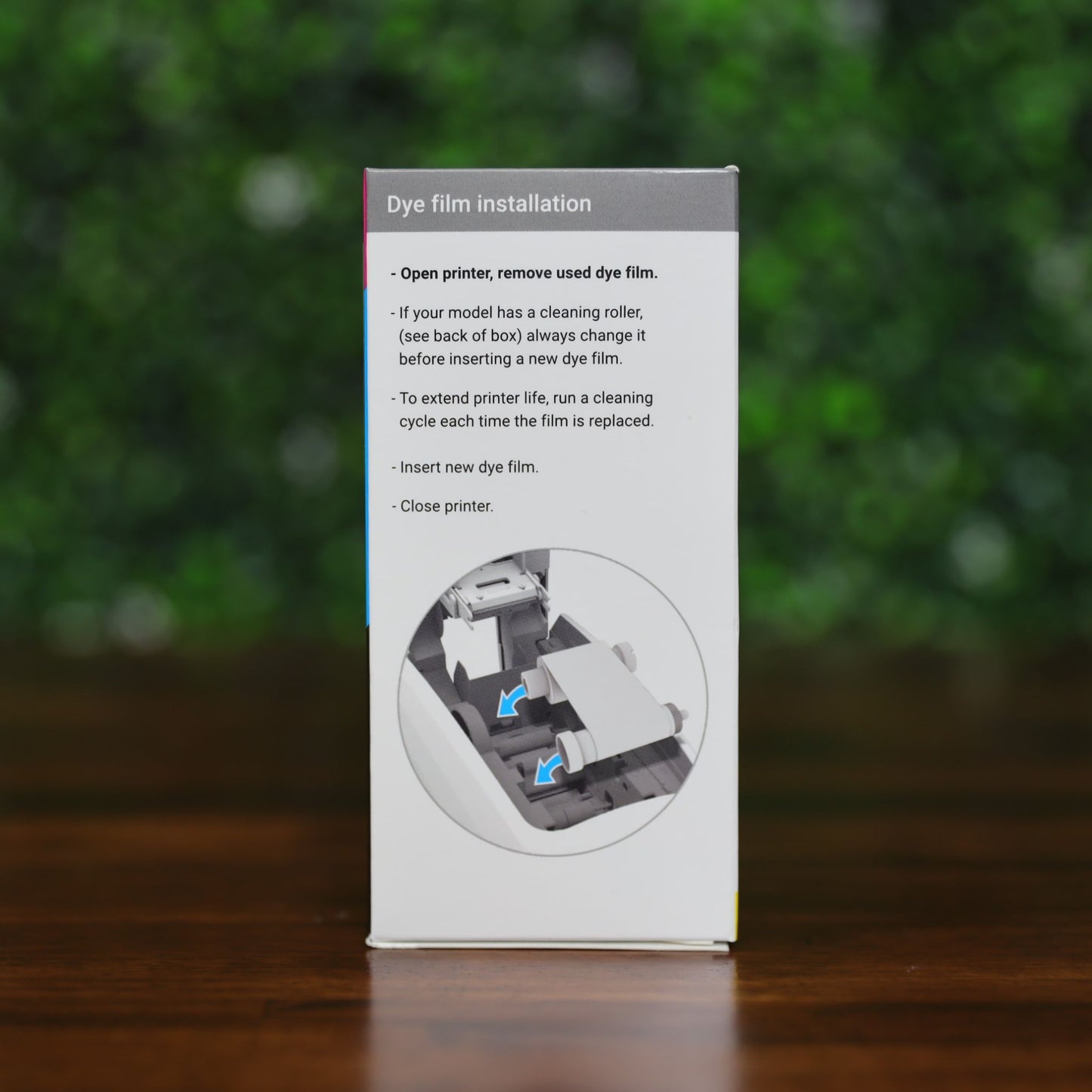 Box displaying installation instructions for the Magicard MB600KO Black Ribbon with Overlay – 600 Prints for Magicard 600 Printer, including a diagram showing how to insert the dye film for producing monochrome ID cards.