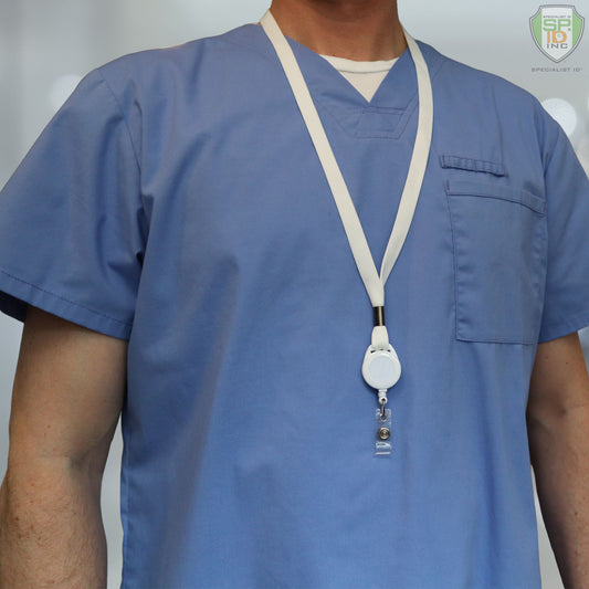 A person dressed in blue medical scrubs is equipped with the Breakaway Lanyard ID Holder Badge Reel Combo (2138-700X). Sold by Specialist ID.