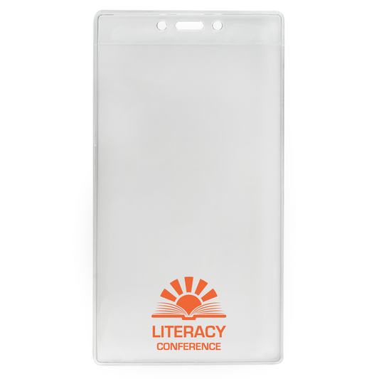 A Customizable 4 X 7 Clear Vertical Large Event Badge Holder (306-4258) with a rectangular shape. It features the text "LITERACY CONFERENCE" in orange, accompanied by a sunrise graphic and an open book illustration. This customizable badge holder is perfect for large events, adding a personalized touch to every attendee's experience.