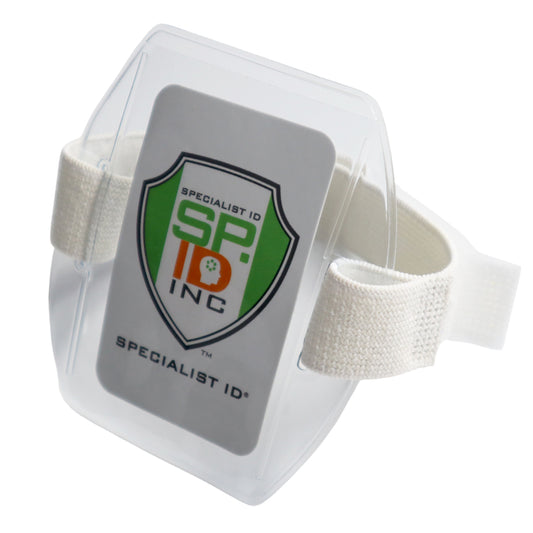 A Vertical Arm Band Vinyl Badge Holder (504-ARNB and 504-ARNW) with a white adjustable strap. The vertical arm band badge holder showcases the logo of "Specialist ID Inc." in green, orange, and black colors on a white background.