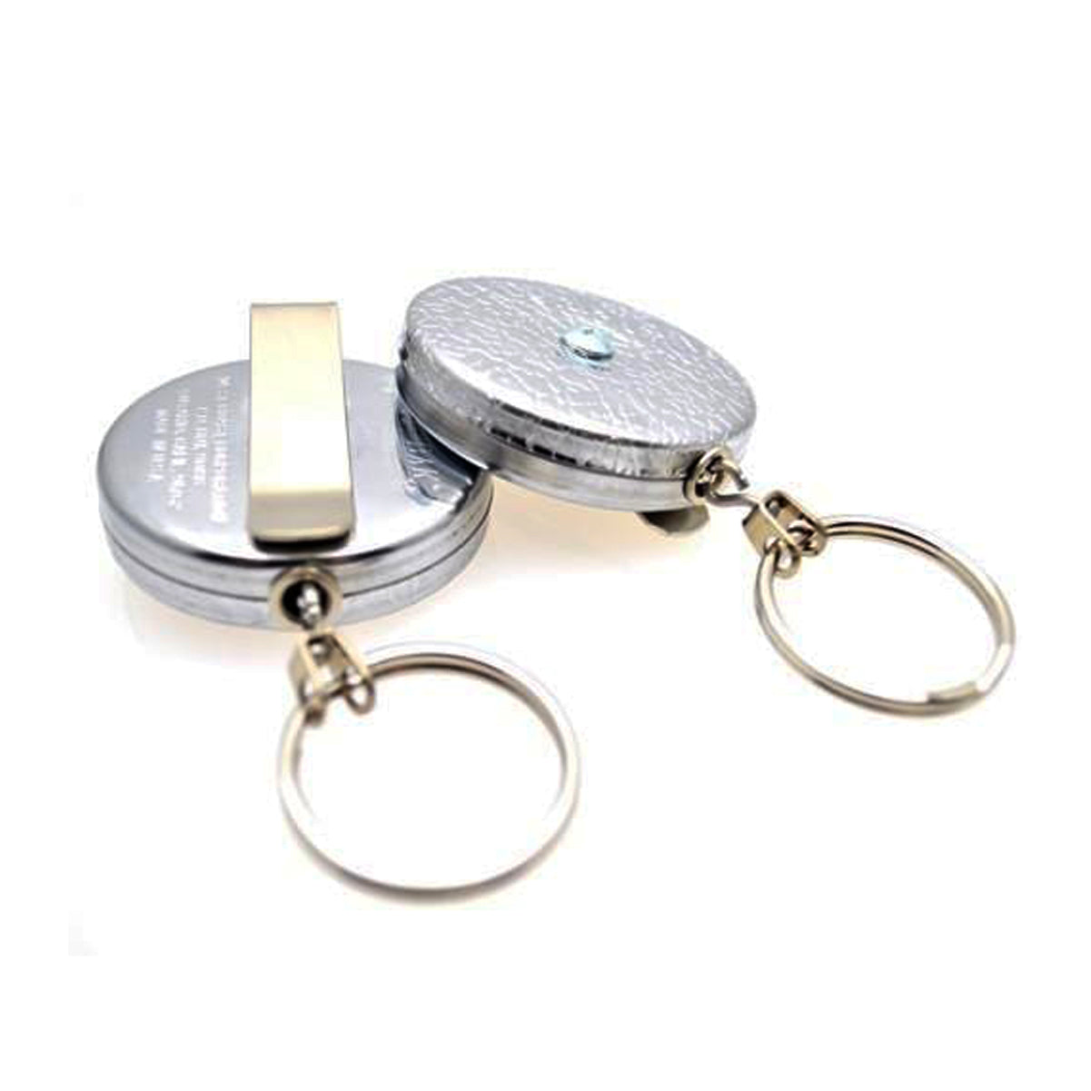 Two metal retractable keychains with attached circular rings, featuring a durable Kevlar cord, and one equipped with a Key-Bak #5 Self Retracting Key Badge Reel on its back. Sold by Specialist ID.