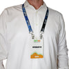 Person wearing a white dress shirt with a double-ended lanyard around a person's neck and 'SPID' design on the lanyard. Bulldog clips on each lanyard strap end holding the event badge through the slot holes provided on the badge.