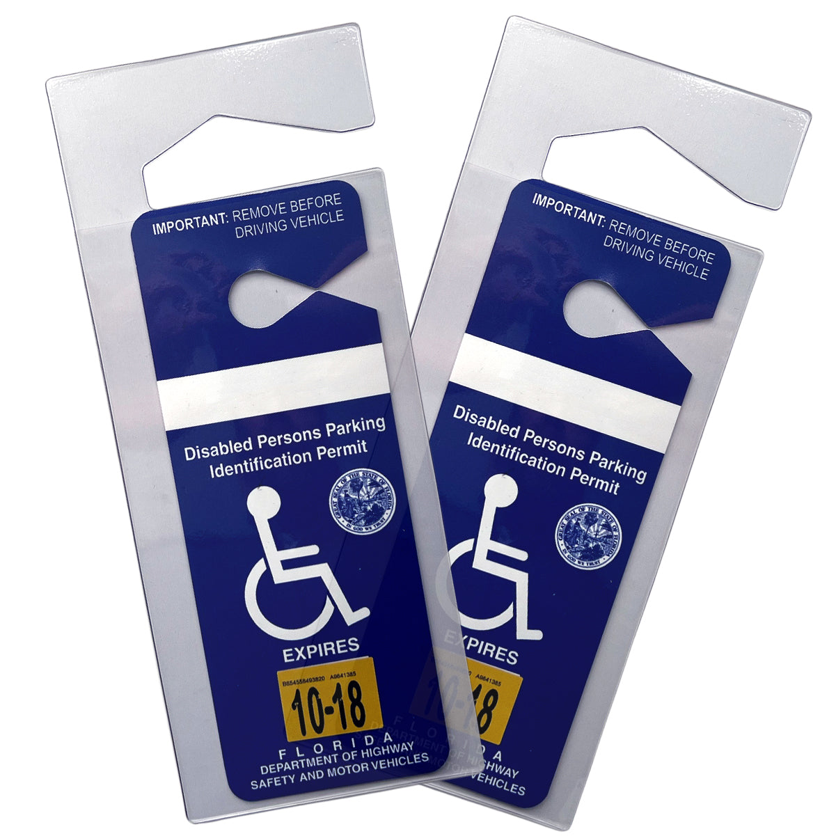 Two Florida disabled persons parking identification permits with blue backgrounds, white disability symbols, and expiration dates of 10-18. The text instructs to remove the Specialist ID Handicap Hang Tag Holder (SPID-1120) before driving.