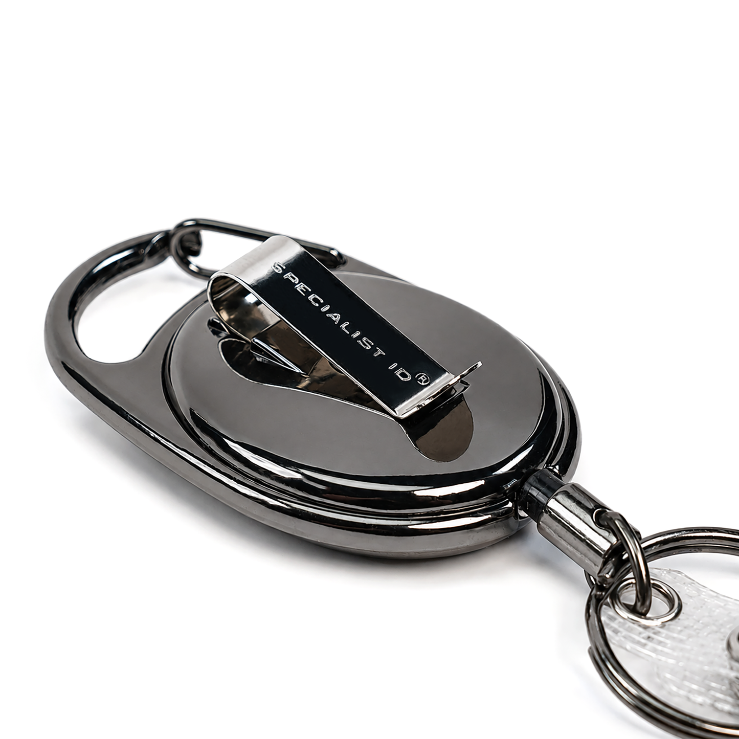 A close-up of a polished gunmetal gray retractable keychain badge reel with a clip, featuring the text 'SPECIALIST ID' on the metal clip, set against a plain white background.