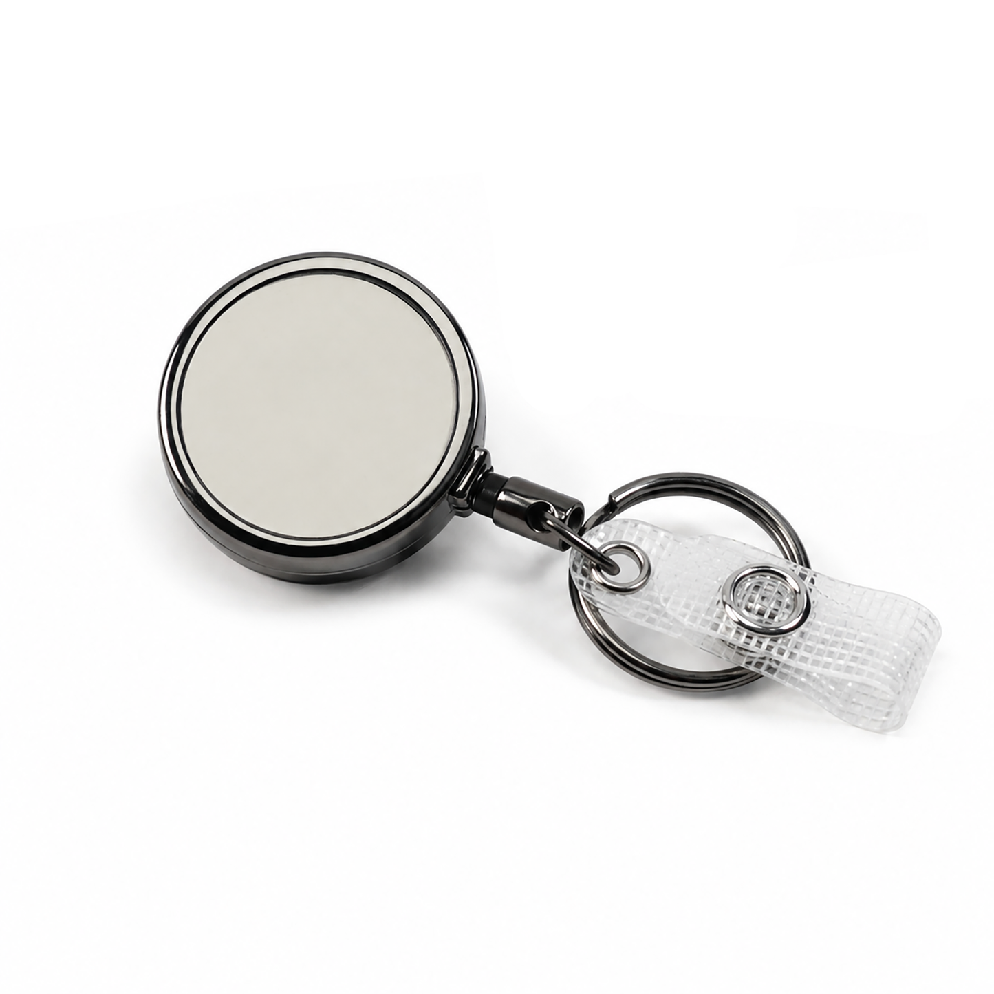 A polished gunmetal badge reel keychain with a circular mirror face, attached to a split key ring and a clear plastic clip on a white background.