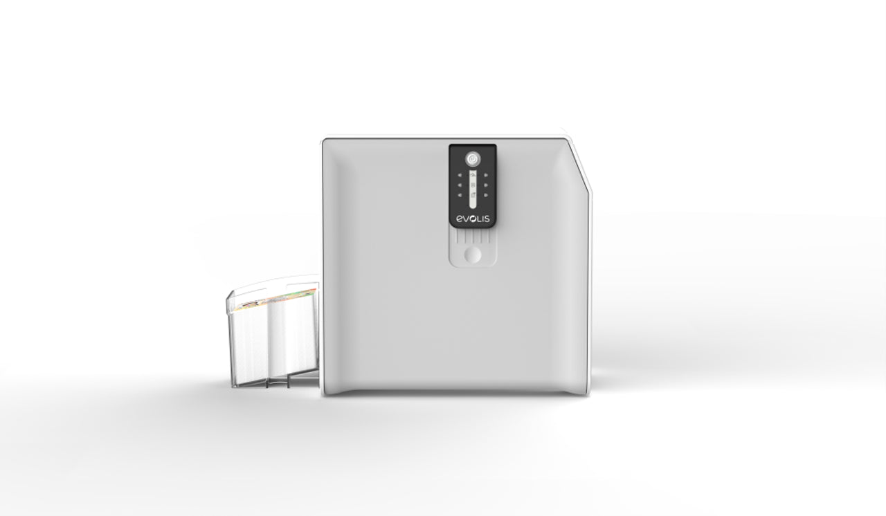 The Evolis S10252 Card Lamination Module (CLM), a compact white device with touchscreen control, is shown beside a transparent cartridge container. It offers secure card protection for Primacy & Primacy 2 printers.
