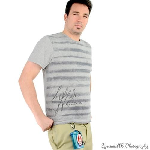 A man stands against a white background, wearing a gray striped t-shirt and khaki pants. He has one hand in his pocket and a small pouch attached to his pants. The image is labeled "Specialist HD Photography." He appears ready for any adventure with his gear safely stored in Witz Waterproof Keep It Clear Sports Cases (008).
