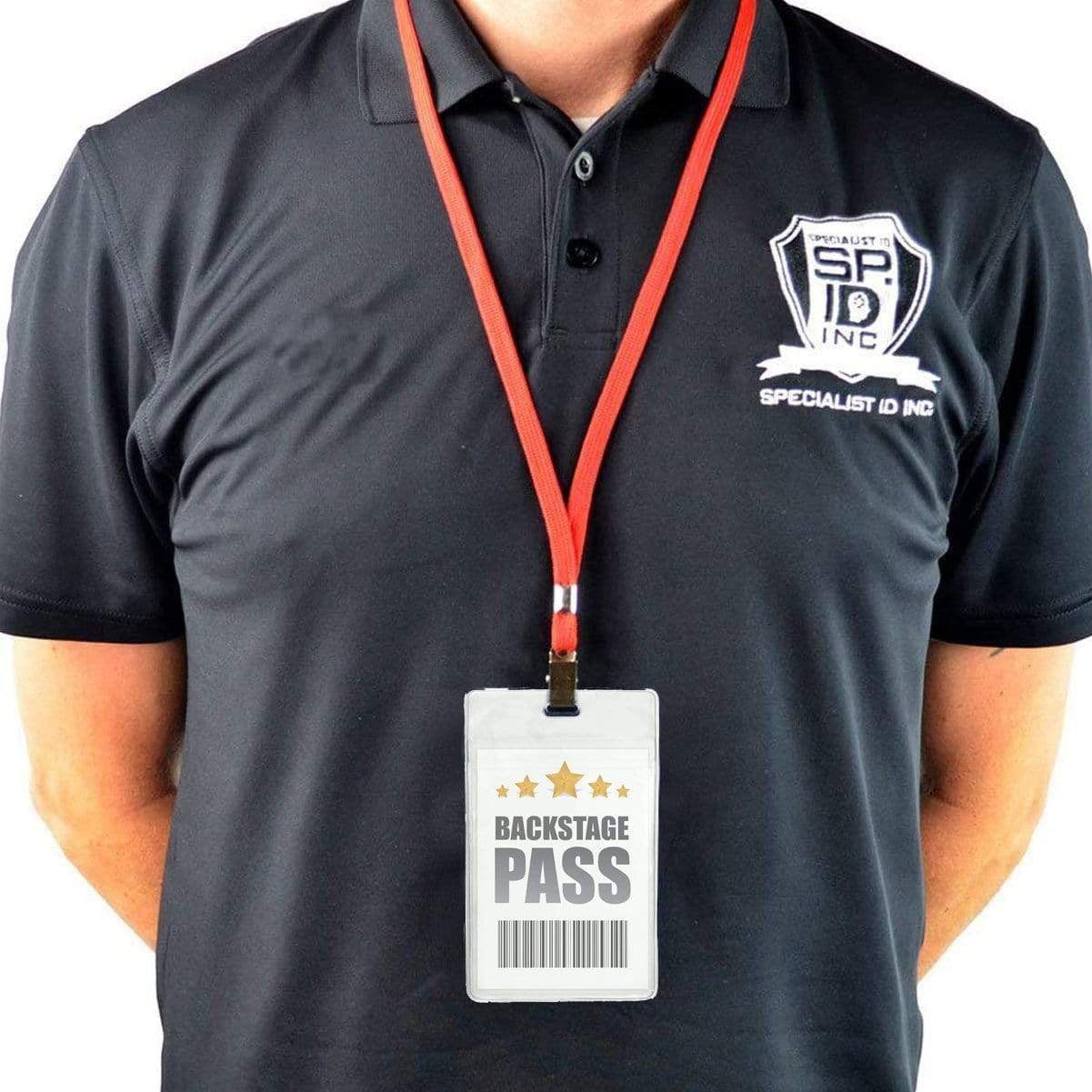 Person wearing a black polo shirt with a company logo and a red lanyard holding a 3 x 4 1/4 Vertical Extra Large Badge Holder with Front And Back Pockets (P/N 1840-1610) labeled "Backstage Pass.