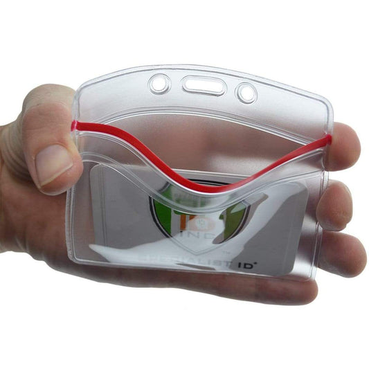 A hand holds a Heavy Duty Clear Vinyl Horizontal Badge Holder With Resealable Zip Top (1815-1010) with a red elastic cord, perfect for securing ID credentials.