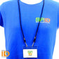 Person wearing a blue t-shirt with the Specialist ID logo and a lanyard holding a photo ID card labeled "Specialist ID Inc" in a Standard Horizontal Vinyl ID Badge Holder (1820-1000).