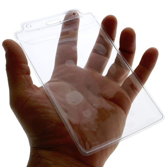 A hand holds a Vertical Extra Large 3 1/2 x 5 1/2 Credential Holder with Flap (P/N 1840-1605) with visible fingerprints on its surface.