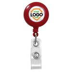 A red Custom Printed Retractable Badge Reels With Belt Clip - Personalize with Your Brand Logo with a clear strap and button clasp. The round center features a placeholder for a logo with the text "YOUR LOGO HERE." Custom badge reels with full color graphics are perfect to promote brand awareness.
