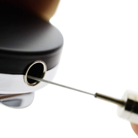Close-up of steel cable extending from the black and chrome heavy duty badge reel, SKU 2120-3305.