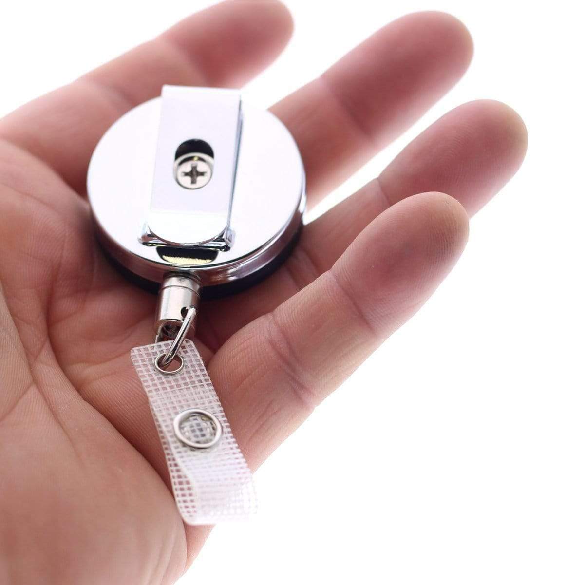A hand holds a Heavy Duty Badge Reel With Chain (P/N 2120-3375) with a white and metallic clip, featuring a retractable chain for added convenience.