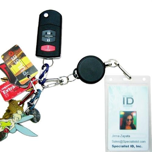 A heavy-duty keychain with various keys, a remote fob, and an ID badge attached via a Ski Pass Holder Retractable Heavy Duty Sport Reel (P/N 2120-4101), perfect as a ski pass holder.