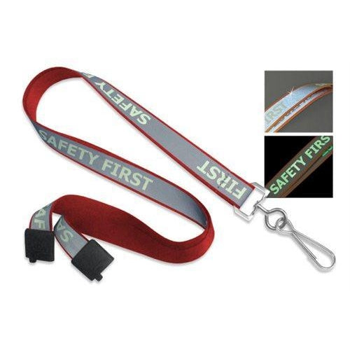 Red and gray "Safety First" Reflective Lanyard With Luminescent Glow in the Dark Print 2135-251X with a metal hook features reflective properties shown in two insets: one in daylight, one in the dark.