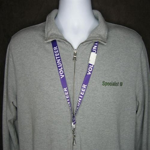 A mannequin wearing a gray zip-up shirt labeled "Specialist ID" with a Purple "Volunteer" Breakaway Lanyard W/ Swivel Hook 2138-5230 around its neck.