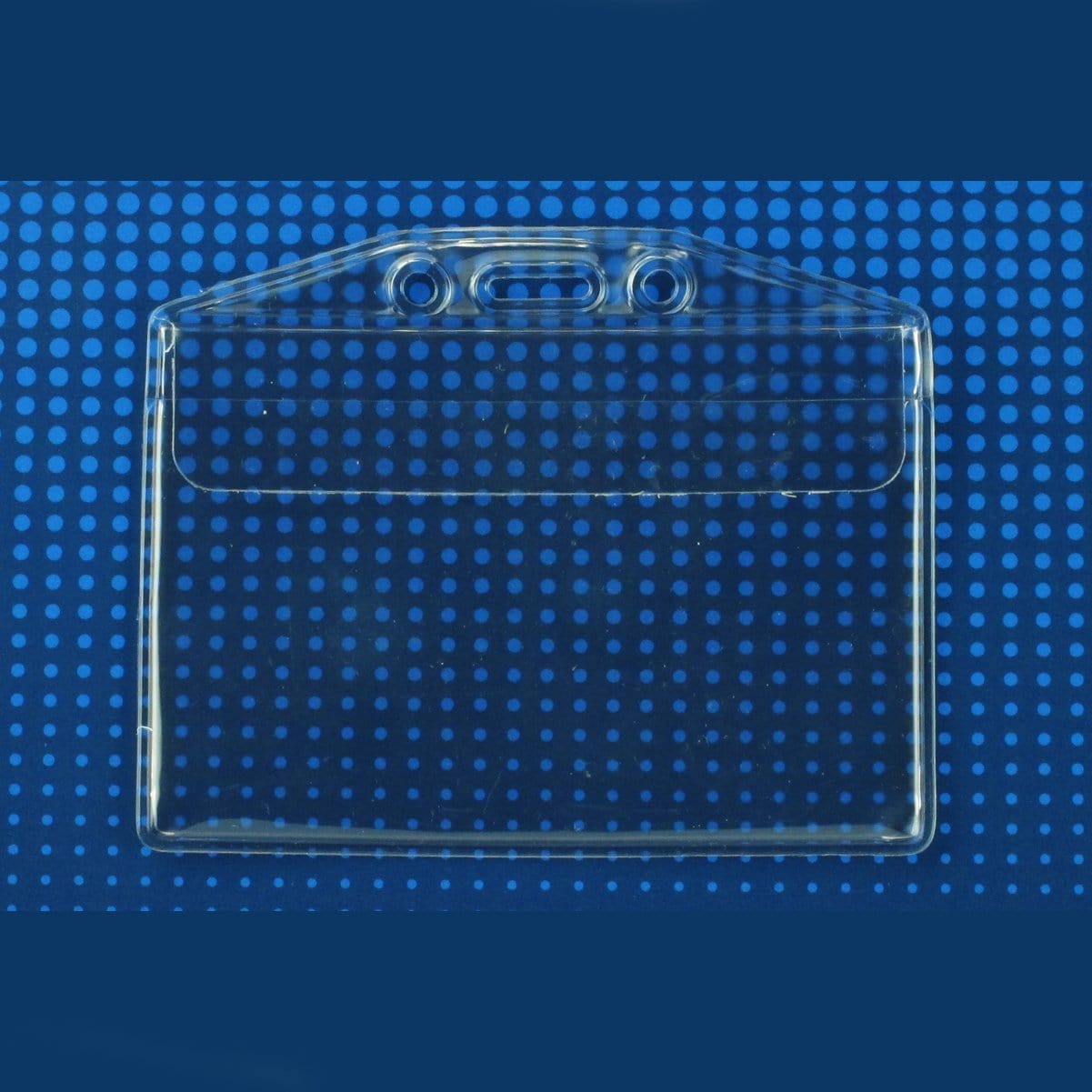 Vinyl Horizontal Badge Holder with Flap (506-43FS) on a blue background with a pattern of white dots.