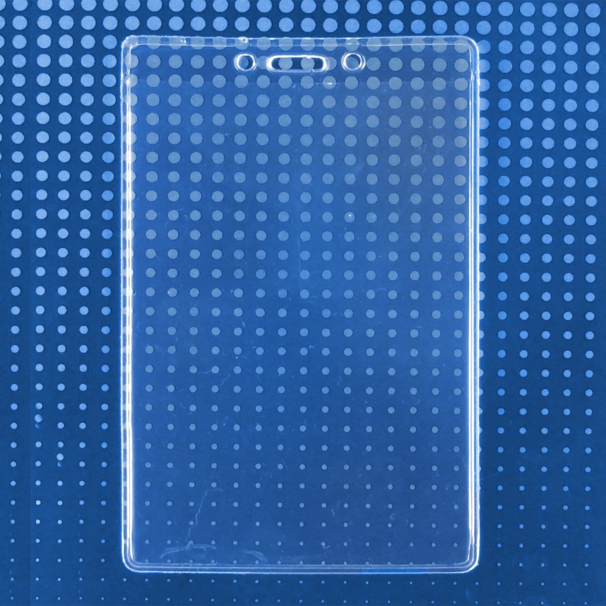 A Premium 3 1/2 x 5 1/4 Clear Vinyl Vertical Extra Large Badge Holder (506-46) is displayed against a dark blue background with a pattern of light blue dots.