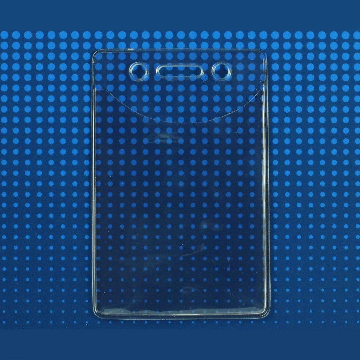 A Premium Vinyl Vertical Badge Holder (506-N) with two circular holes and a horizontal slot for attachment against a blue dotted background.