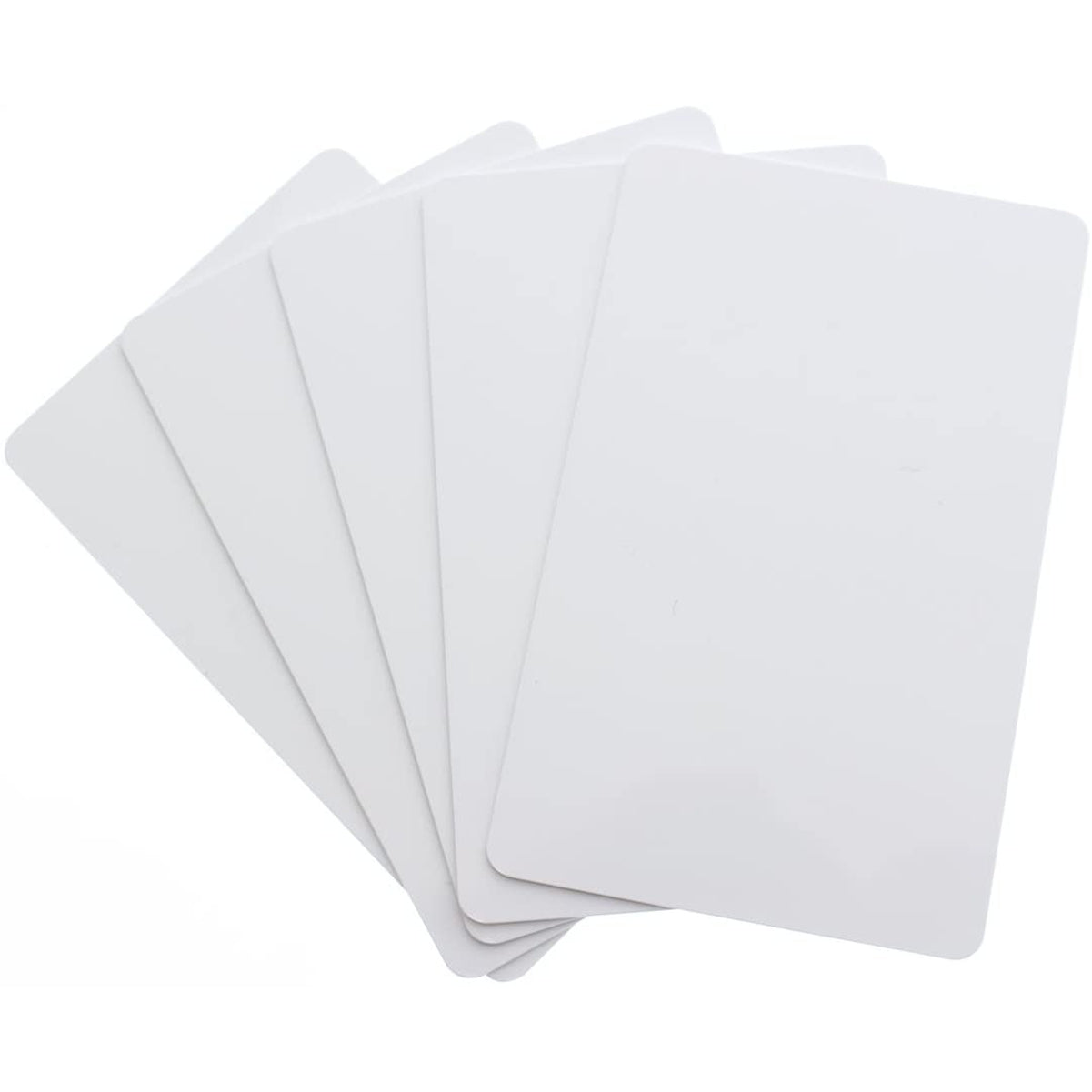 Six Premium Blank PVC Cards for ID Badge Printers - Graphic Quality CR80 30 Mil (CR80), white, rectangular cards fanned out slightly overlapping.