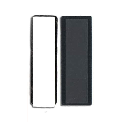 Two rectangular objects are pictured side by side against a white background. The object on the left is white with black edges, and the object on the right is black with a dark gray center. These Magnetic Badge Holders with Dual Magnets and Zinc-Plated Backing Plate (5730-3060) are ideal for professional environments.