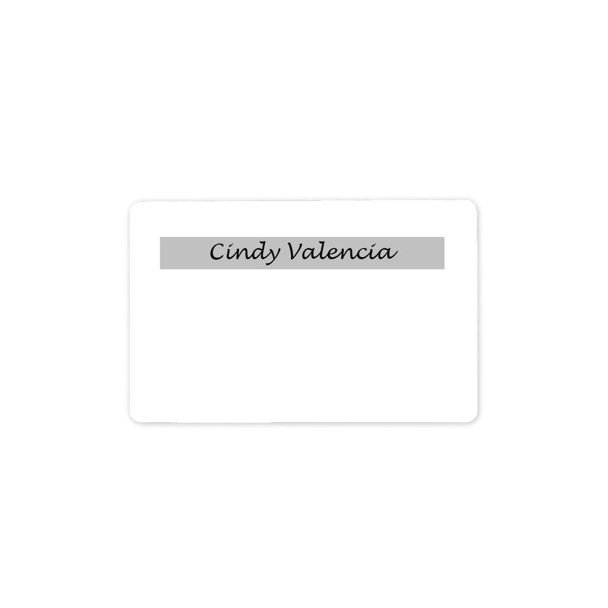 A white rectangular name tag, crafted from Standard CR80 30mil Signature Panel PVC Cards - 1000 cards, features the text "Cindy Valencia" in a sleek black font within a gray bar at the top.