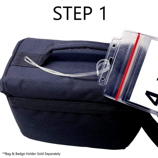 A black bag with a handle next to an Extra Long 9" Luggage Tag Loop - Clear Worm Loops for Luggage Tags (2410-2100) on a string. Text reads "STEP 1," and fine print states "Bag & Badge Holder Sold Separately." The badge holder features a durable flexible strap for added convenience.