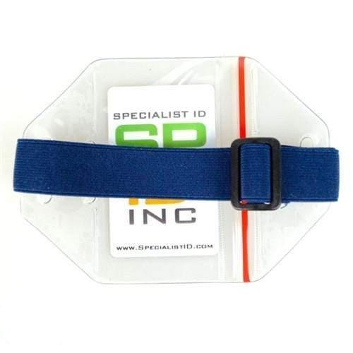Close-up of a transparent plastic ID holder with a dark blue adjustable strap and a company name "Specialist ID" visible inside, resembling the versatility of a Vertical Arm Badge Holder with Elastic Band And Zip Lock Seal (ABH-V-BLU-ZIP).