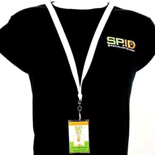 A person wears a black T-shirt with the "S.P.I.D." logo and a white lanyard holding an ID card in a clear Top Load Rigid Clear Vertical Badge Holder (AC-915) with the same logo.