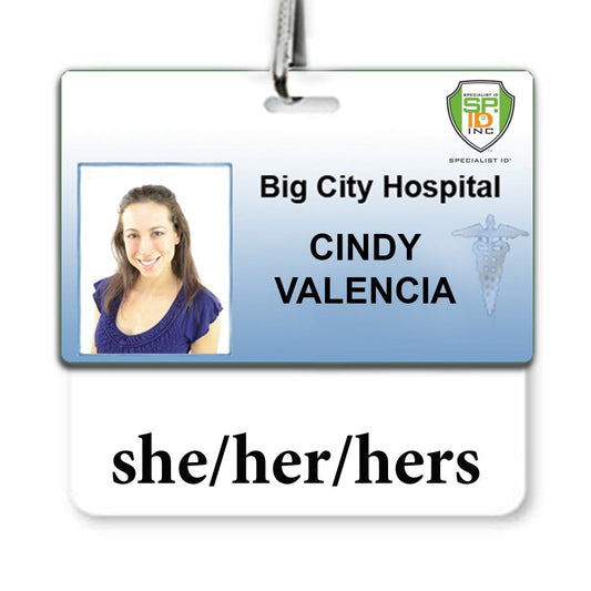 Pronoun Badge buddy She/Her/Hers Horizontal with White Border for Cindy Valencia at Big City Hospital, featuring her photo and a caduceus symbol. Pronouns listed are she/her/hers. Badge attached to a lanyard.