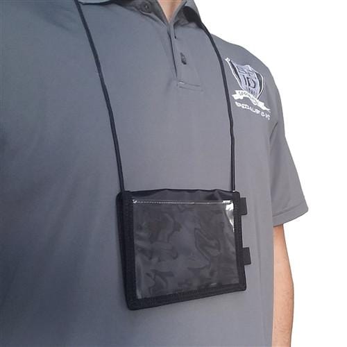 A person wearing a gray polo shirt with a logo, accessorized with a Vinyl Credential Neck Wallet with Pen Loop (CW-5-BLK) featuring an adjustable lanyard, holding a clear plastic badge holder around their neck.