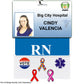 A hospital ID badge for "Cindy Valencia" from Big City Hospital, marked "RN," and expertly utilizing a Pin Buddy Badge for Displaying Pins with Badge Buddies - Horizontal to display various pins, including a vote pin, awareness ribbons, and a medical symbol.