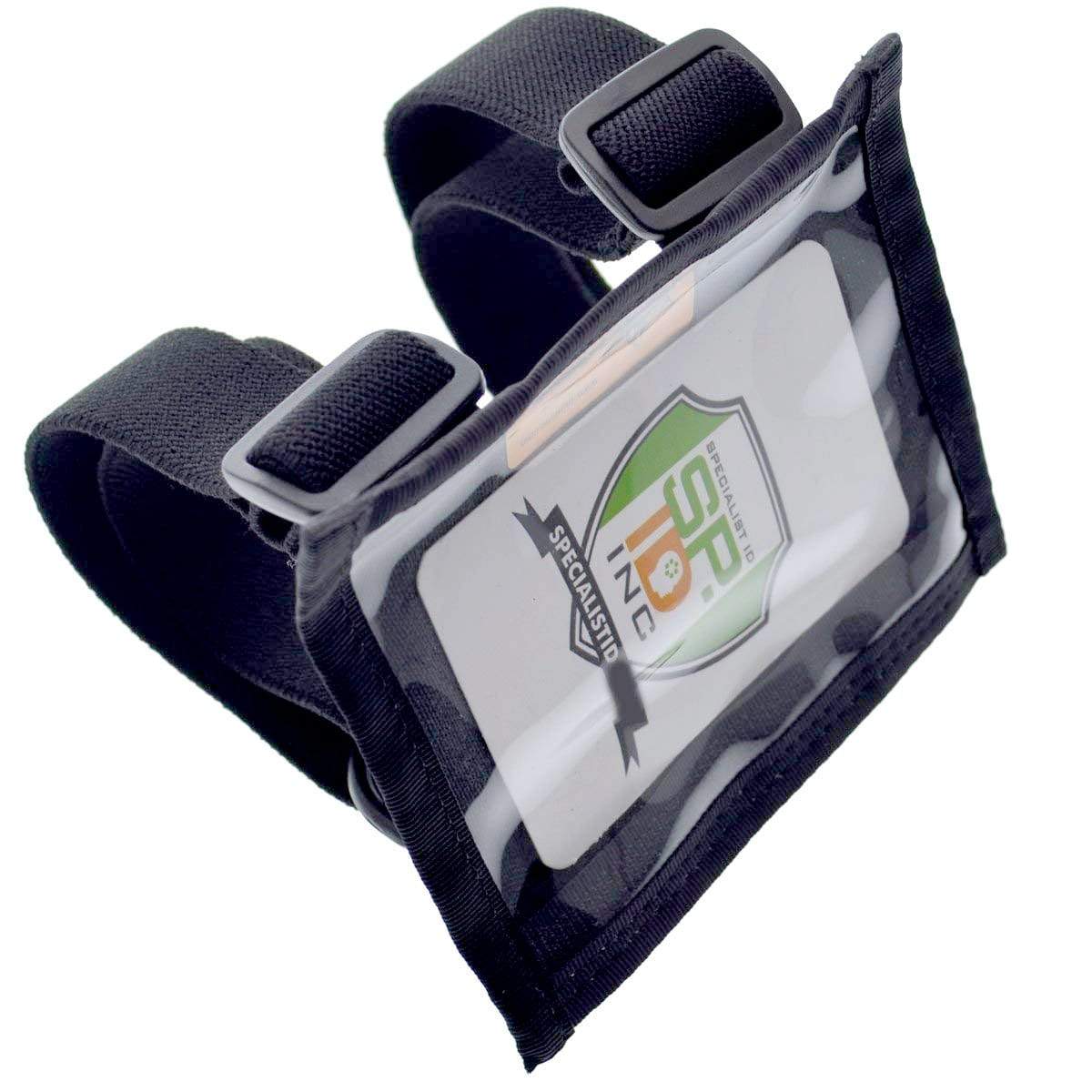 A black tactical armband with adjustable straps and a transparent pocket holding a card displaying an SP INC logo, perfect for use as a Raine Military ID Badge Armband Holder with Two Straps (SPID-1090).
