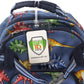 A blue backpack with a dinosaur pattern and a Clear Plastic Luggage Identification Tags with Loops Included - Business Card or Photo Insert (Locking Top) attached to the top handle. The tag, featuring a green shield logo, reads "SP ID, INC" and "SPECIALIST ID". The secure loops keep it firmly in place.