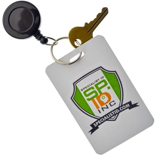 A Badge Reel With Belt Clip & Key Ring (P/N 525-ISR) attached to an ID card with the logo "Specialist ID Inc." printed on it.