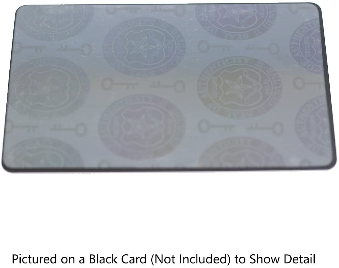 A rectangular card with a Self Adhesive Holographic Overlay - Shield and Key showcasing keys and circular emblems. The text in the image notes that it's pictured on a black card, which is not included, to show detail. This design offers anti-counterfeiting protection and serves as a Seal of Authenticity for your items.