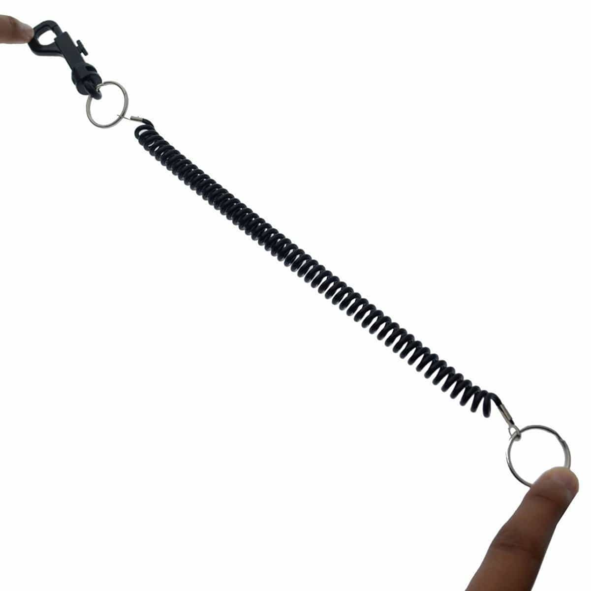 Black elastic coil cord stretched between fingers for card and key access