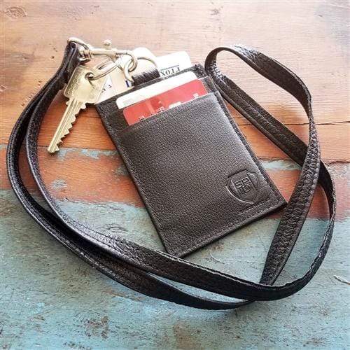 A Heavy Duty Union Made Genuine Leather ID Badge Holder Wallet & Lanyard (SPID-9590-BLACK) holds keys and several cards, including a red card that is partially visible.