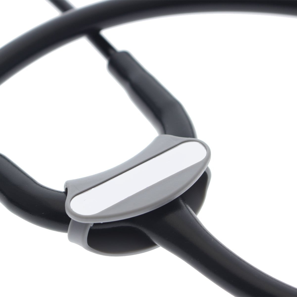 Close-up of a black Littmann Cardiology stethoscope with a gray and white Yoke Stethoscope ID Tags - Blank with Write on Surface (Cardio & Cardiology Compatible) (SPID-9760) holder attached to the tubing—a perfect tool for medical professionals.