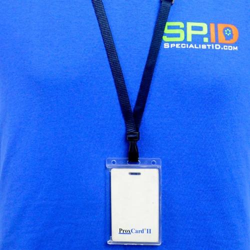 Person wearing a blue shirt with "SP.ID" logo and a lanyard holding a ProxCard II ID badge, showcasing their Vertical 70 - 90 Mil ProxCard II / Thick HID Proximity Card Holder (SPID-PROX-V).