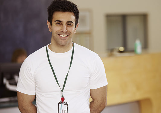 employee wears new personalized lanyard with an attached badge holder