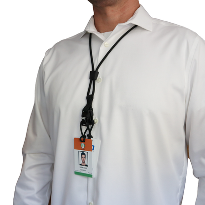 A person wearing a white shirt sported an ID badge on a Black EK Lanyard Plus II with Two Detachable Soft End Loops around their neck. Sold by Specialist ID.