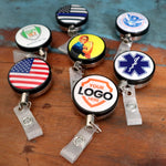 Custom heavy duty badge metal badge reel with retractable steel cord and metal belt clip - Custom designs examples for USA Flag design, medical, government  insignia, and more