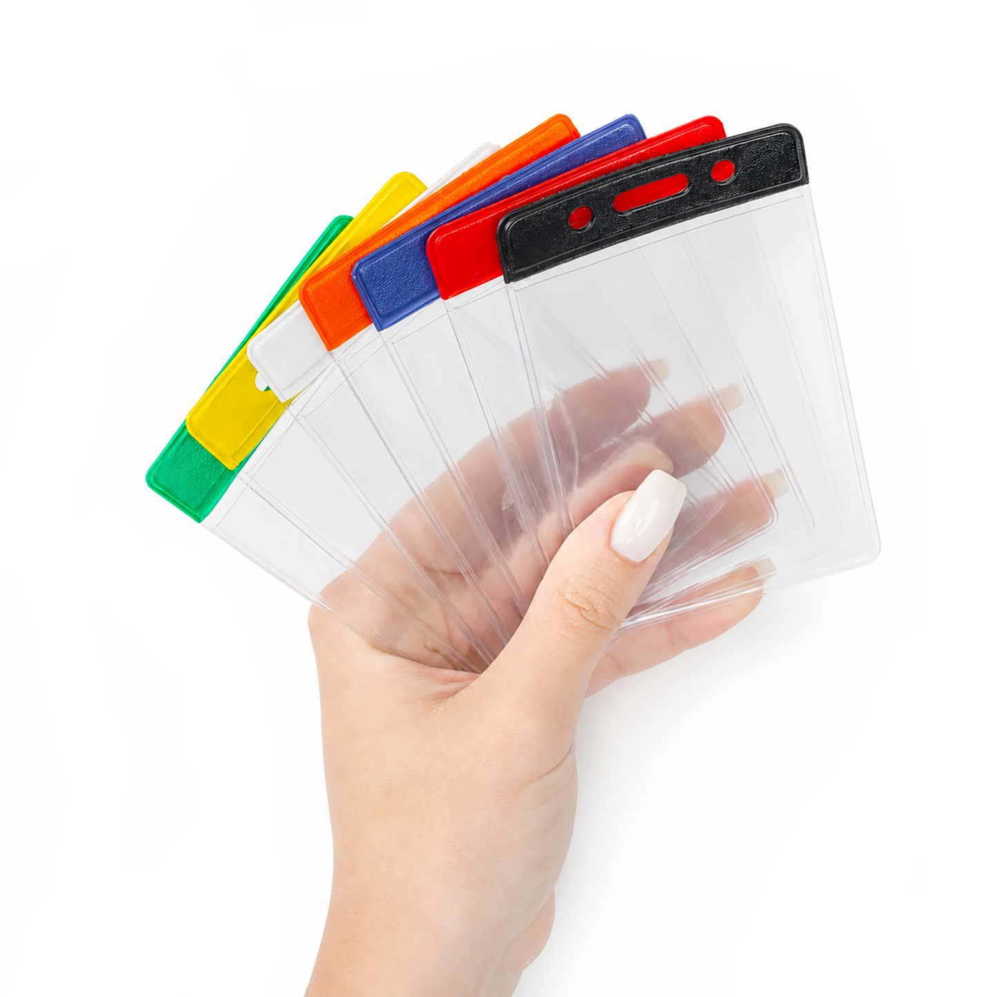 A hand holding a fan of clear plastic ID badge holder sleeves with top colorful bar tabs in green, yellow, orange, blue, red, and black, shown against a plain white background.