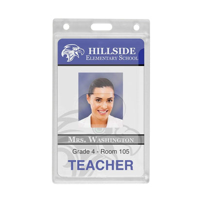 ID badge for Hillside Elementary School featuring a photo of a female teacher labeled Mrs. Washington, Grade 4, Room 105. The badge is encased in a Custom Vertical Rigid Plastic Card Holder (1840-6500) - Personalize with Your Logo that showcases the school's brand logo on the front.