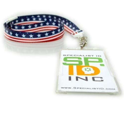 A lanyard with an American flag design is attached to a Custom Vertical Open Faced Plastic ID Badge Holder (1840-816X) - Upload Your Logo displaying the logo and website of Specialist ID Inc., perfect for those seeking custom ID badge holders.
