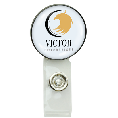A round, white Custom Printed Non-Retractable Badge Reel with Metal Clip (2105-4001) - Add Your Logo, featuring the Victor Enterprises logo in black text and a golden eagle design. This custom badge reel is perfect for professional identification needs.