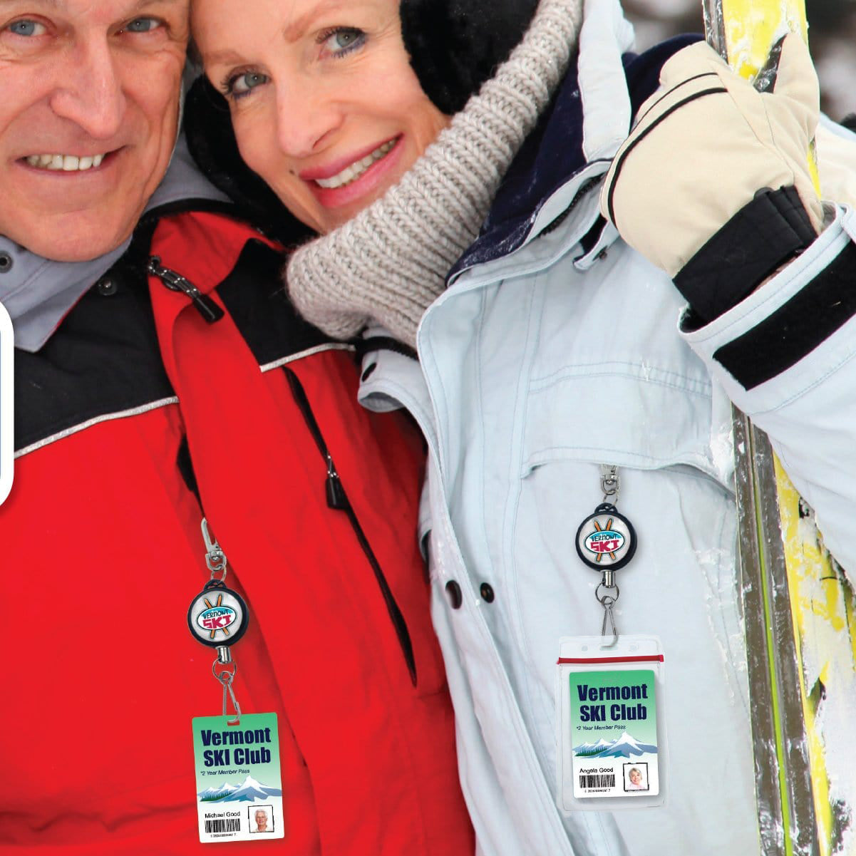 Two people dressed in winter jackets, scarves, and earmuffs hold ski poles. Both have "Vermont Ski Club" badges hanging from their Custom Retractable Ski Pass Holder - Heavy Duty Sport Reel (2120-4101) - Add Your Logo.