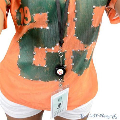 Person wearing an orange shirt with the number 89, white shorts, and an ID badge on a Custom Design Badge Reel that Attaches to Your Lanyard - Add Your Logo. Sold by Specialist ID.